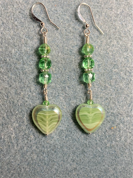 Light green Czech glass heart bead earrings adorned with light green Czech glass beads.