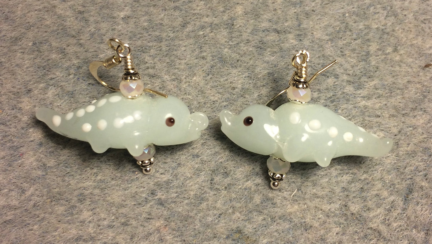 Opaque off white lamp work spotted alligator bead earrings adorned with off white Chinese crystal beads.