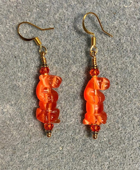 Orange fiber optic (cat’s eye) standing otter bead earrings adorned with orange Chinese crystal beads