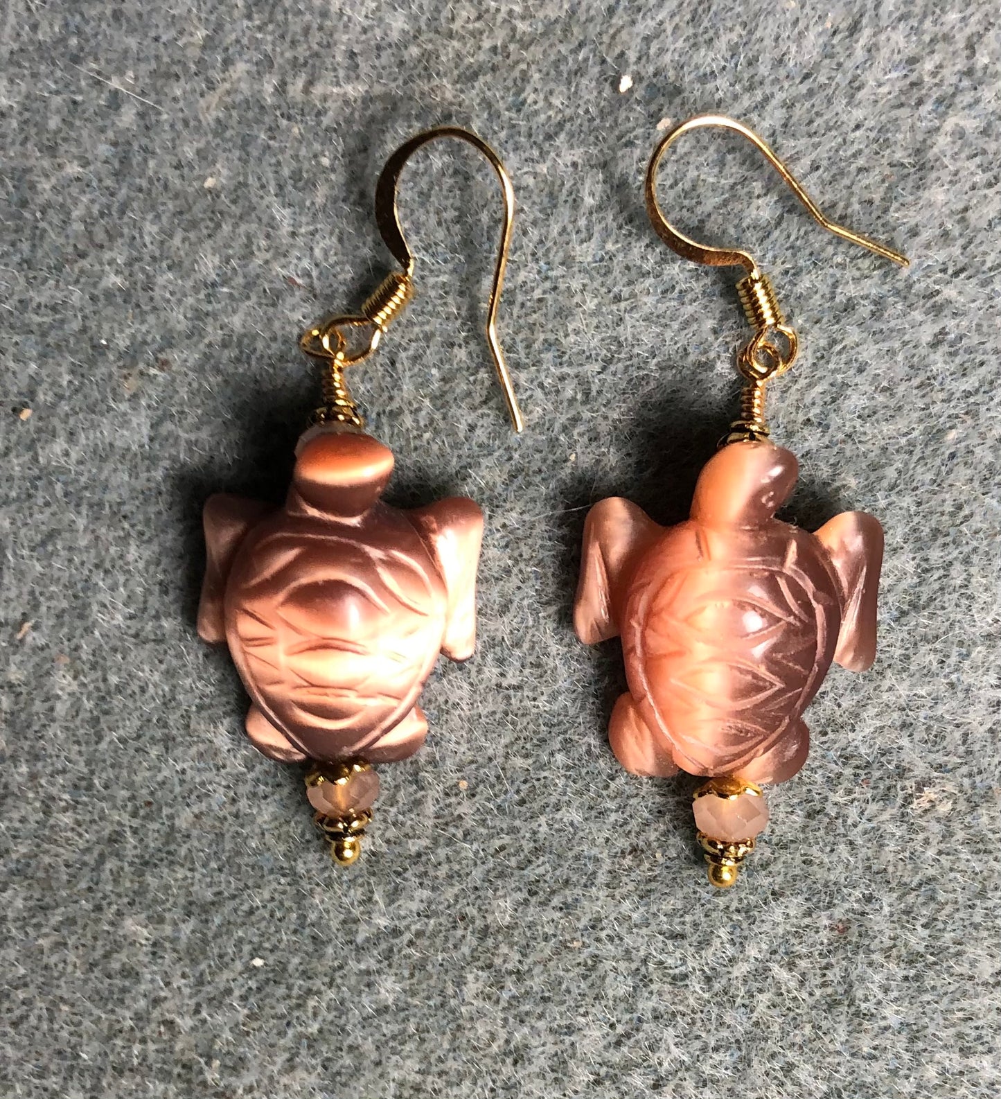 Peach brown fiber optic (cat’s eye) turtle bead earrings adorned with peach Chinese crystal beads.