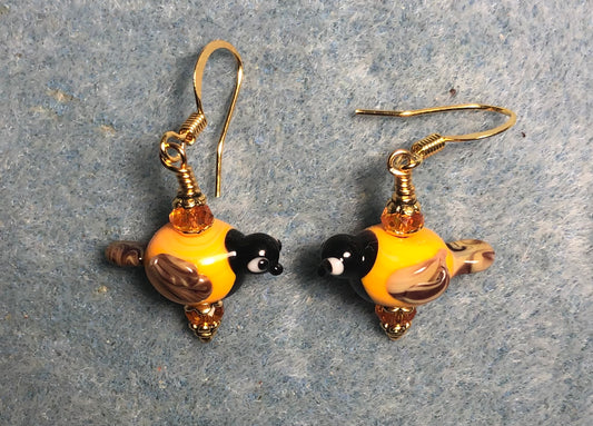 Small tangerine and black lamp work titmouse bird bead earrings adorned with tangerine Chinese crystal beads.