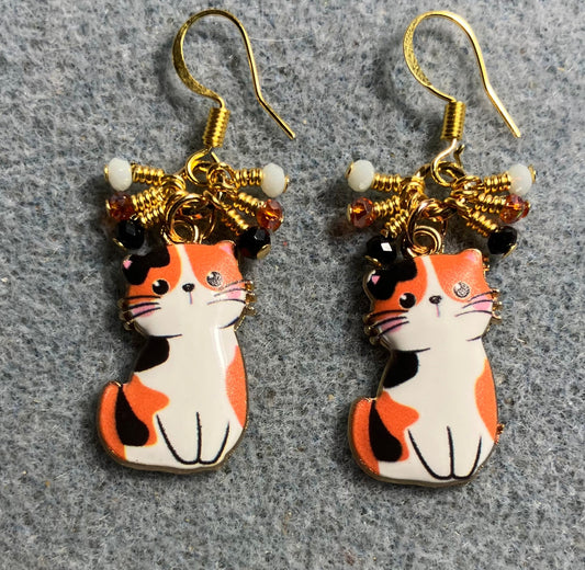 Orange, white, and black enamel calico cat charm earrings adorned with tiny dangling orange, white, and black Chinese crystal beads.
