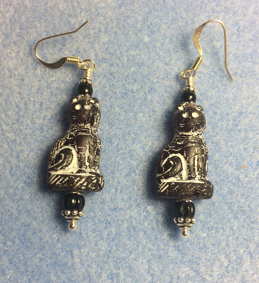 Black (with white inlay) fancy Czech glass cat bead earrings adorned with black Czech glass beads.