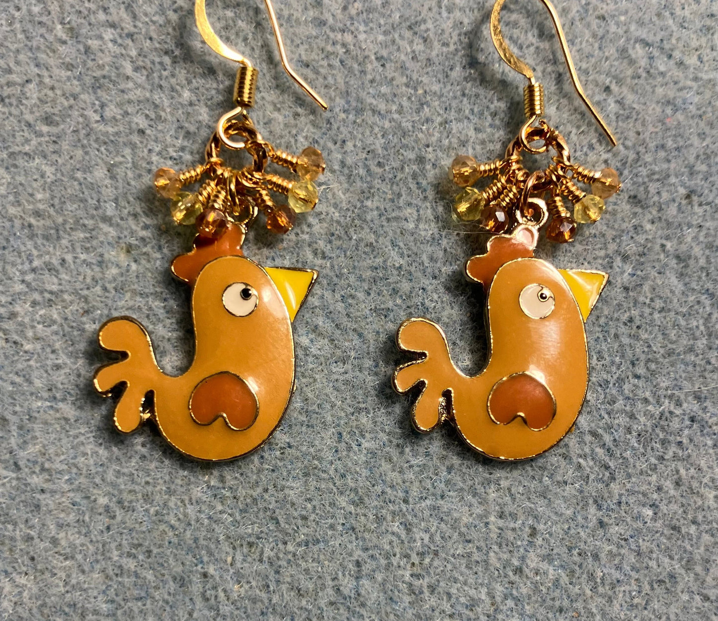 Brown, amber, and yellow enamel chicken charm earrings adorned with tiny dangling brown, amber, and yellow Chinese crystal beads.
