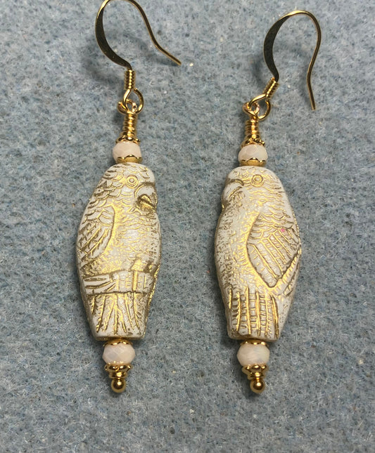 Large off white (with gold wash) Czech glass parrot bead earrings adorned with off white Chinese crystal beads.