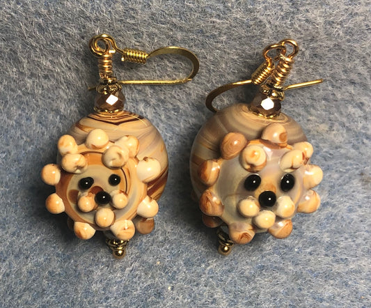 Amber lamp work lion bead earrings adorned with amber Chinese crystal beads.