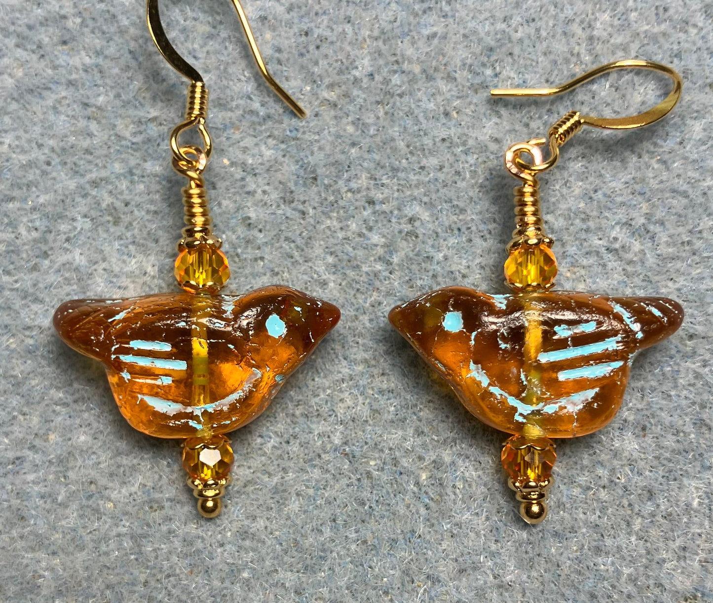 Amber (with turquoise inlay) Czech glass bird bead earrings adorned with amber Chinese crystal beads.