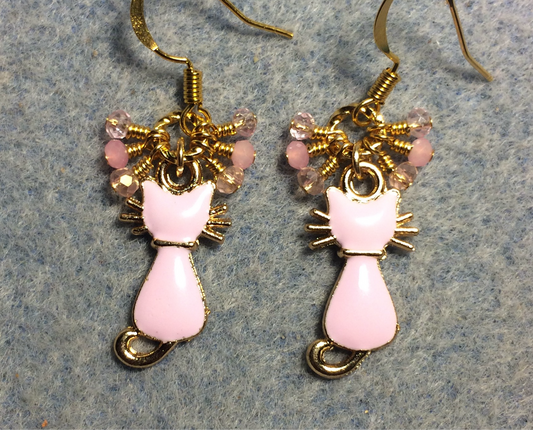 Small light pink and gold enamel cat charm earrings adorned with tiny dangling light pink Chinese crystal beads.