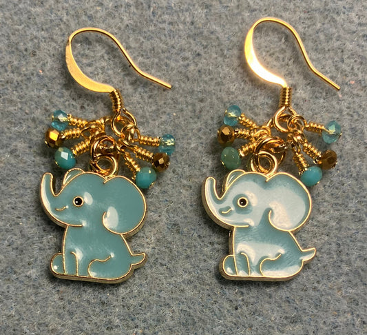 Aqua and gold enamel elephant charm earrings adorned with tiny dangling aqua and gold Chinese crystal beads.