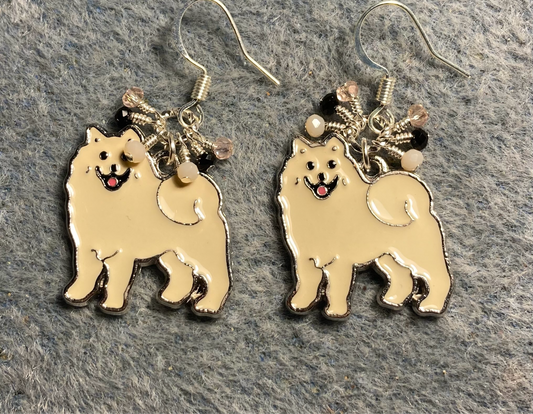 White enamel Samoyed charm earrings adorned with tiny dangling white, pink, and black Chinese crystal beads.
