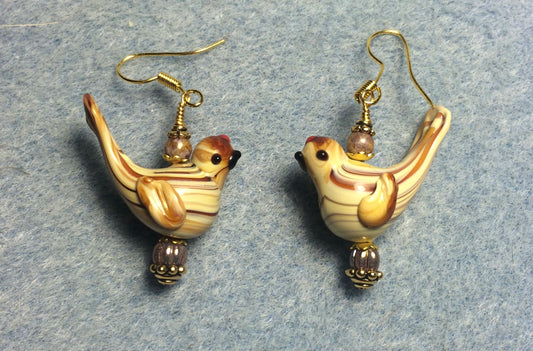 Tan lamp work striped songbird bead earrings adorned with tan Czech glass beads.