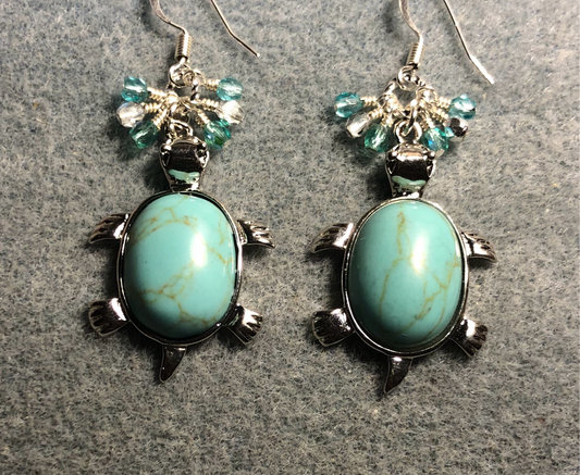 Large silver and light turquoise howlite gemstone turtle charm earrings adorned with small dangling light turquoise and silver Czech glass beads.