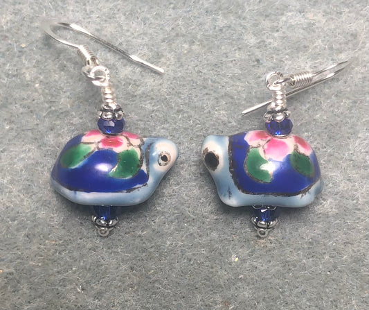 Small blue and pink vintage ceramic turtle bead earrings adorned with dark blue Chinese crystal beads.