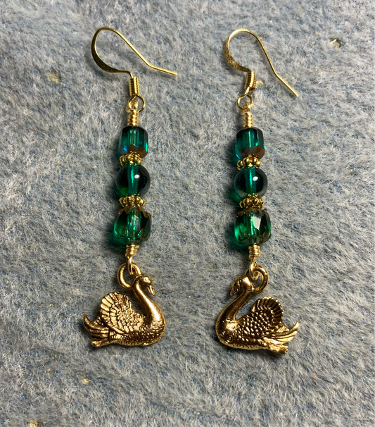 Gold swan charm earrings adorned with teal Czech glass beads