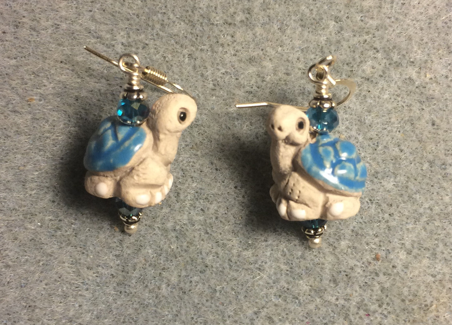 Small turquoise and tan ceramic turtle bead earrings adorned with turquoise Chinese crystal beads.