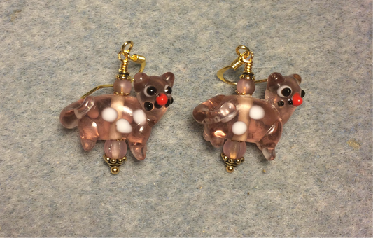 Translucent rose pink lamp work spotted cat bead earrings adorned with rose pink Czech glass beads.
