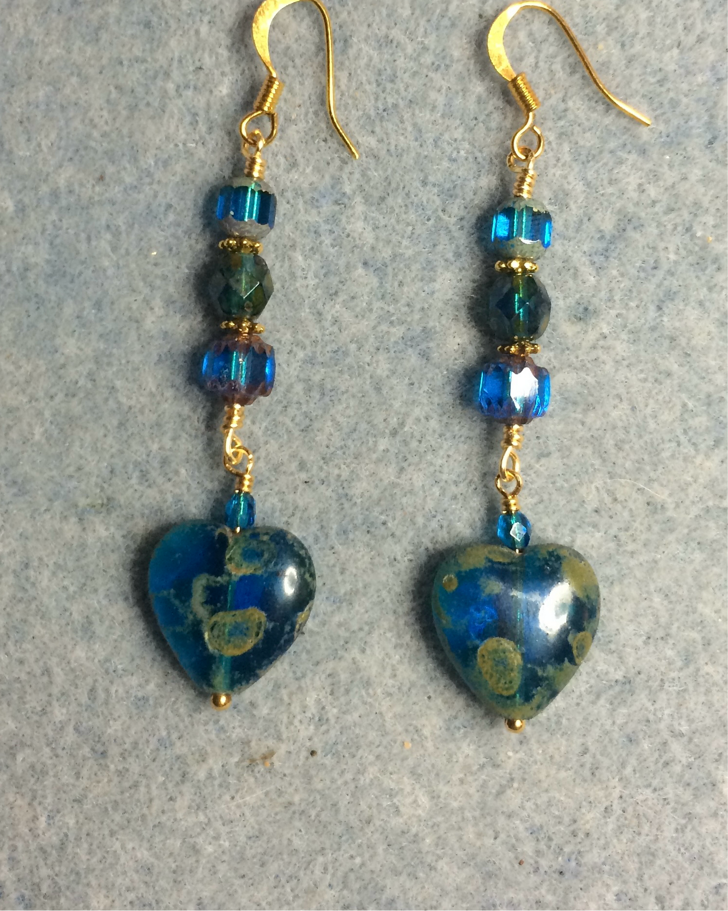 Turquoise travertine Czech glass heart bead earrings adorned with turquoise Czech glass beads.