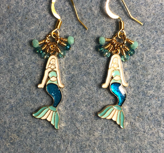 Teal and turquoise enamel mermaid charm earrings adorned with tiny dangling teal and turquoise Chinese crystal beads.