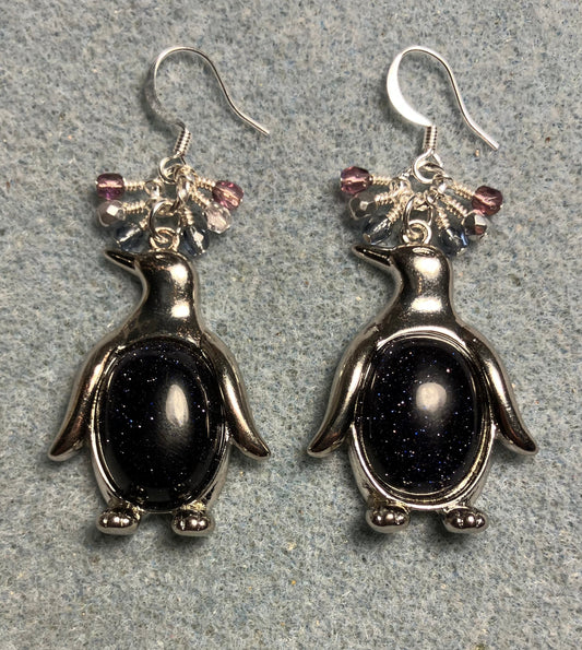 Large silver and blue goldstone gemstone penguin charm earrings adorned with small dangling blue, purple, and silver Czech glass beads.