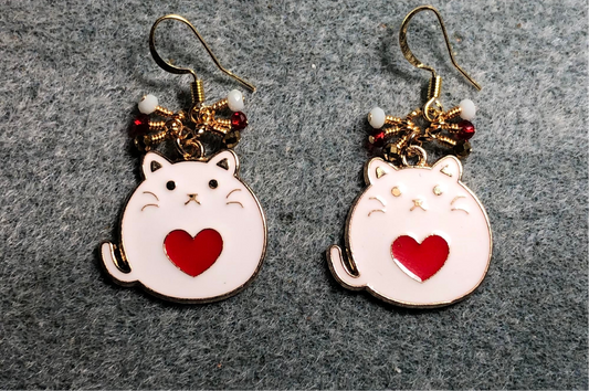 White and red enamel fat cat charm earrings adorned with tiny dangling red, white, and gold Chinese crystal beads.