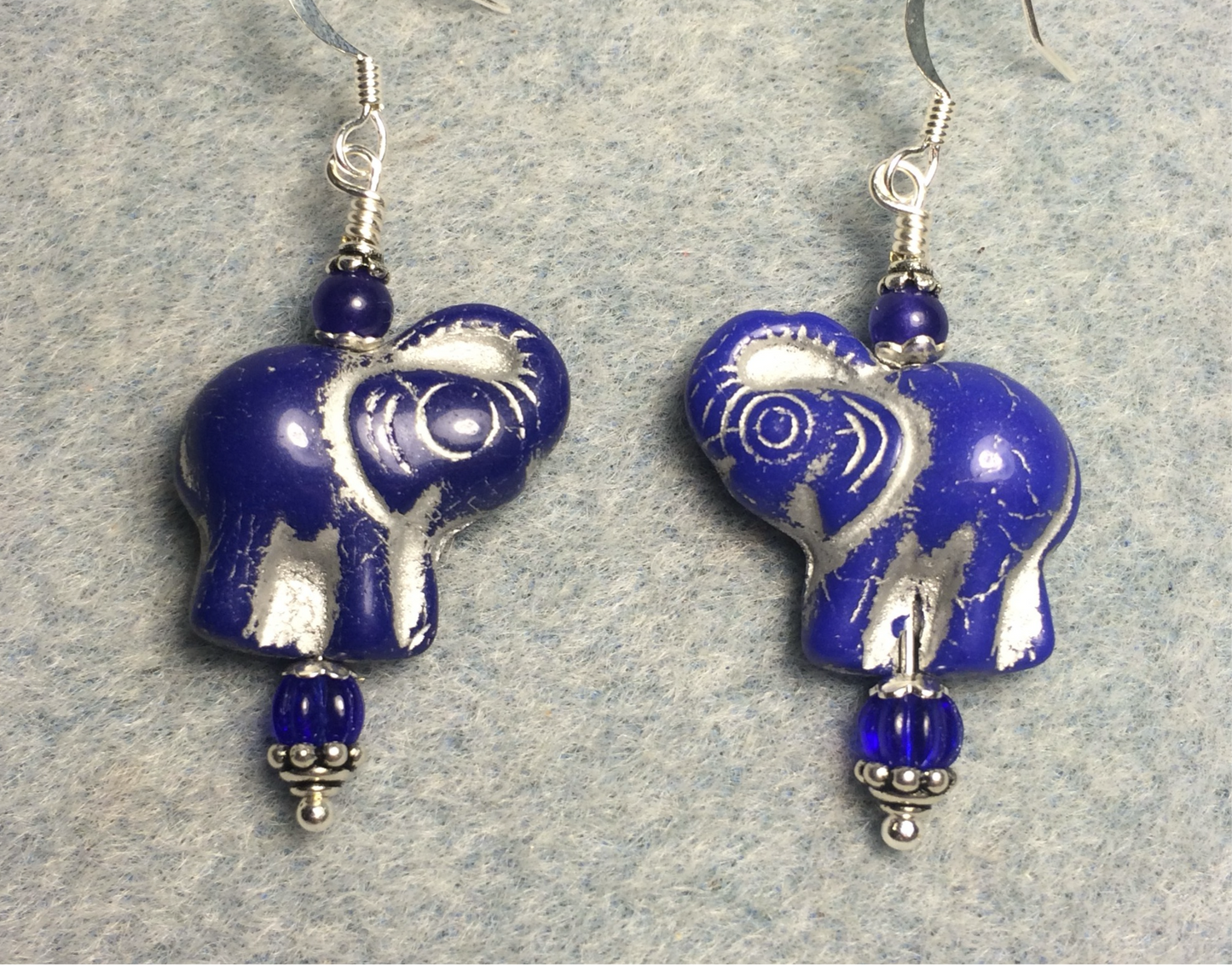 Opaque dark blue (with silver inlay) Czech glass elephant bead earrings adorned with dark blue Czech glass beads.