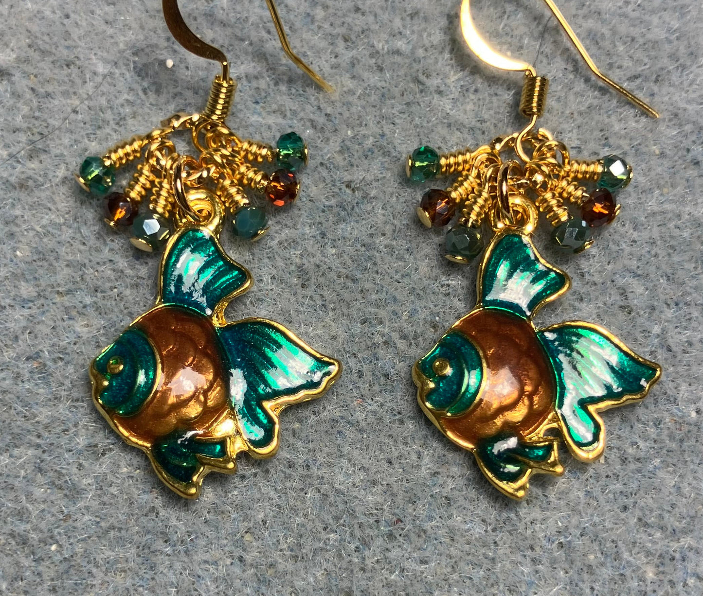 Teal and brown enamel angelfish charm earrings adorned with tiny dangling teal and brown Chinese crystal beads.