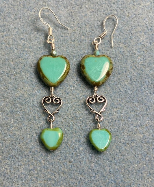 Large and small matching opaque turquoise Czech glass heart bead earrings joined by silver Tierracast heart connectors.