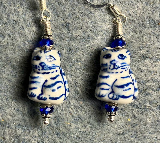 Blue and white ceramic tabby bead earrings adorned with blue Chinese crystal beads.