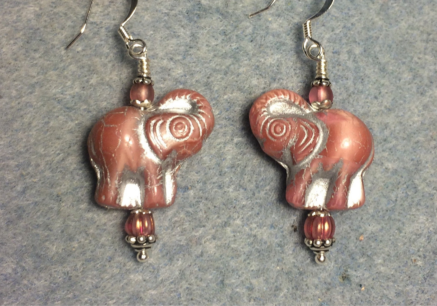 Rose pink (with silver inlay) Czech glass elephant bead earrings adorned with rose pink Czech glass beads.