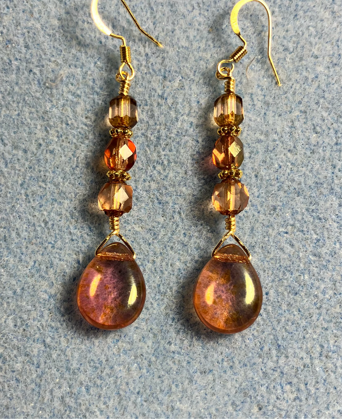 Rose gold Czech glass pear drop bead earrings adorned with rose gold Czech glass beads.