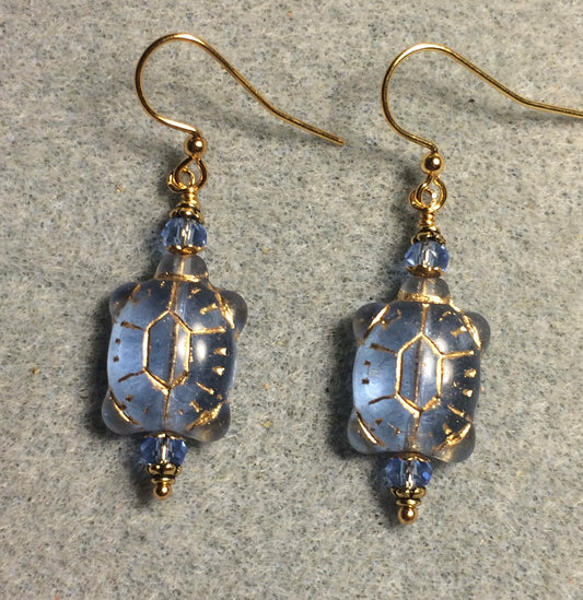 Light blue (with gold wash) Czech glass turtle bead earrings adorned with light blue Chinese crystal beads.