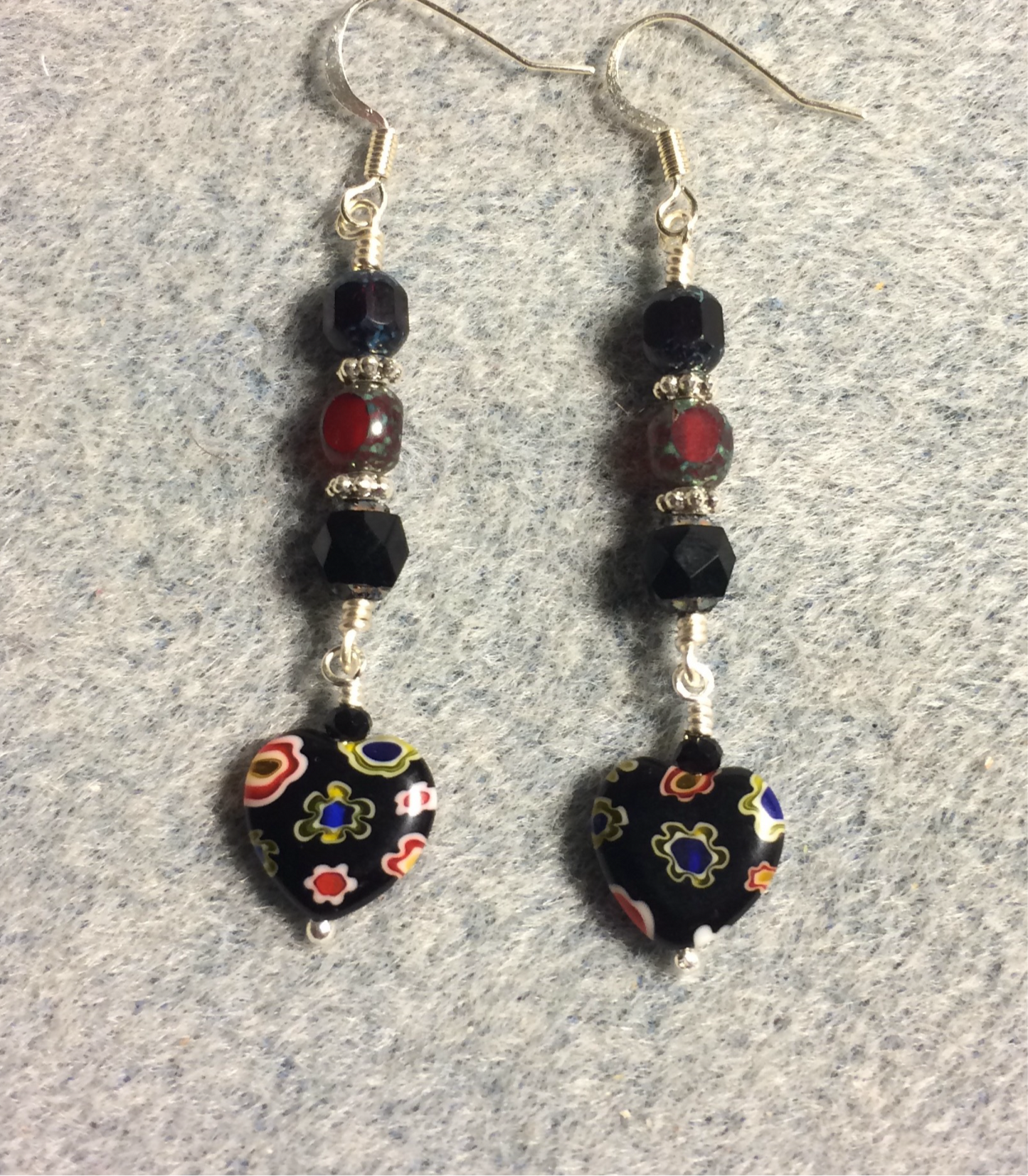 Small black and dark red millefiori Czech glass heart bead earrings adorned with black and dark red Czech glass beads.