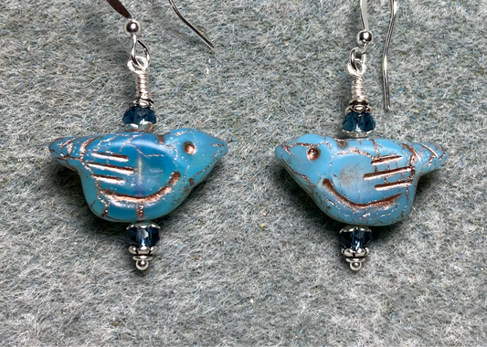 Opaque light blue (with copper wash) Czech glass bird bead earrings adorned with blue Chinese crystal beads.