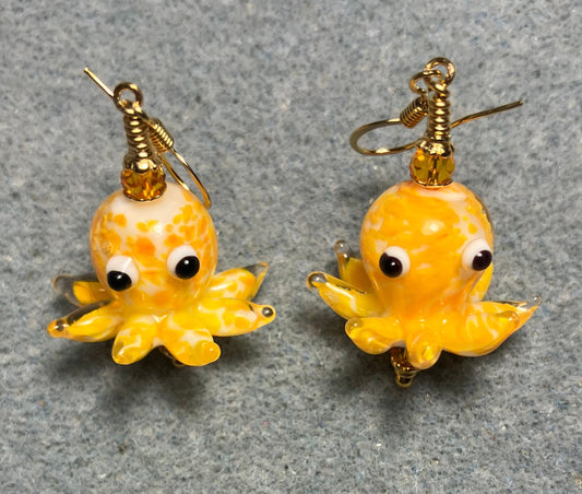 Tangerine and white mottled lamp work octopus bead earrings adorned with tangerine Chinese crystal beads.