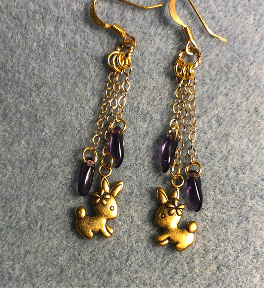 Small gold bunny charm earrings attached to gold chain and at adorned with small purple Czech glass dagger beads