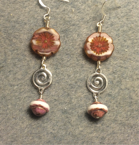 Pink and white Czech glass pansy bead earrings adorned with silver swirly connectors and pink Czech glass Saturn beads.