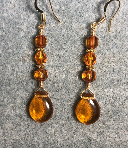 Amber Czech glass pear drop bead earrings adorned with  light amber Czech glass beads.