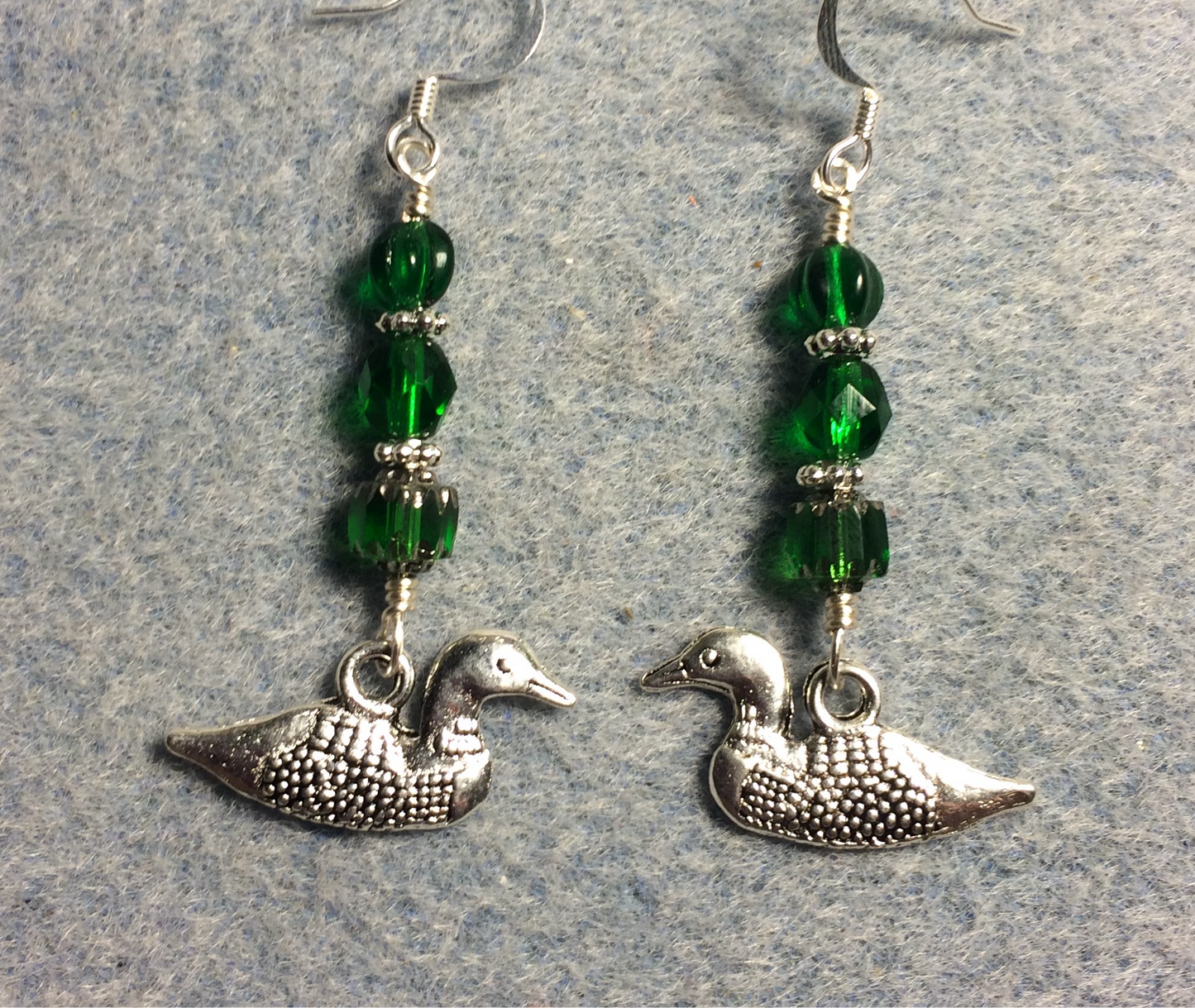 Silver mallard duck (loon) charm earrings adorned with emerald green Czech glass beads.