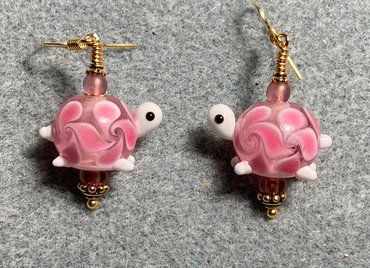 Rose pink lamp work turtle bead earrings adorned with rose pink Czech glass beads.