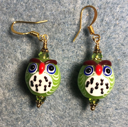 Lime green and white lamp work spotted owl bead earrings adorned with lime green Chinese crystal beads.
