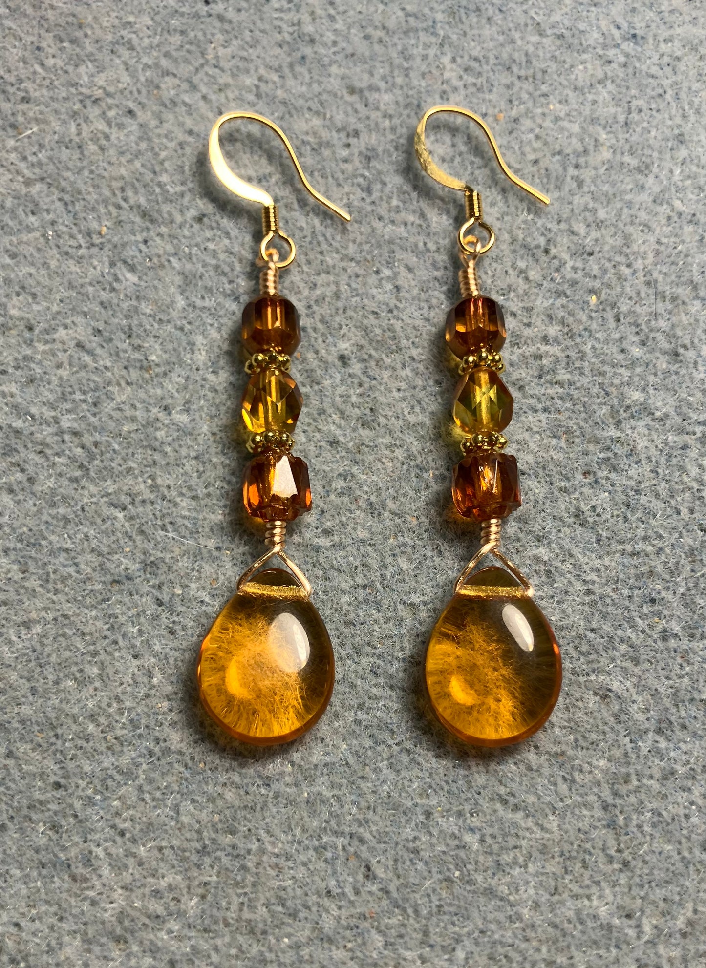 Amber Czech glass pear drop bead earrings adorned with  amber Czech glass beads.