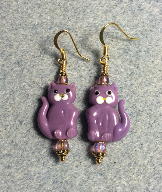 Opaque violet lamp work cat bead earrings adorned with violet Czech glass beads.
