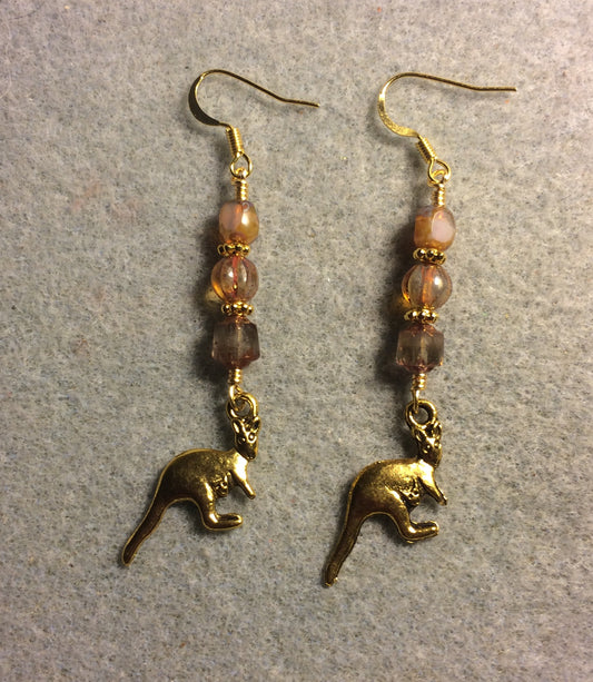 Gold kangaroo charm earrings adorned with beige Czech glass beads