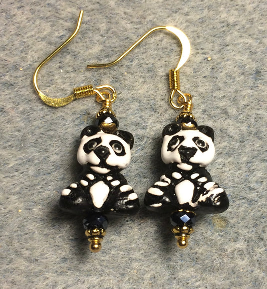 Small black and white ceramic panda bear bead earrings adorned with black Chinese crystal beads.