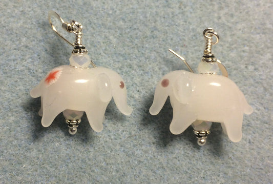 Opaque off white lamp work elephant bead earrings adorned with off white Chinese crystal beads.
