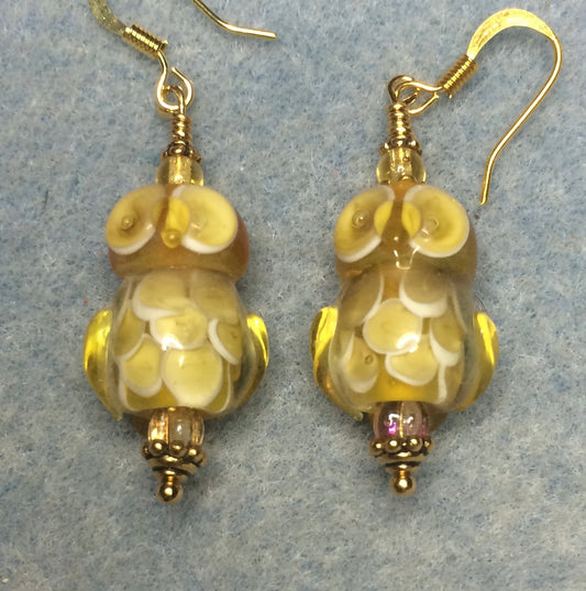 Topaz yellow lamp work owl bead earrings adorned with topaz Czech glass beads.