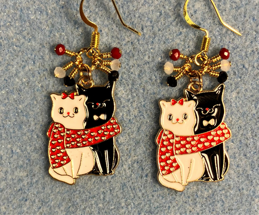 Black, white, and red enamel cat charm earrings adorned with tiny dangling black, red, and white Chinese crystal beads.
