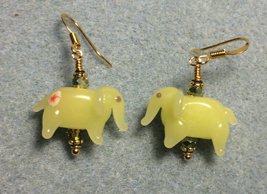 Opaque olive green lamp work elephant bead earrings adorned with olive green Chinese crystal beads.