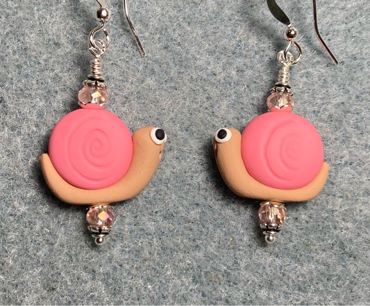 Pink and tan polymer clay snail bead earrings adorned with pink Chinese crystal beads.