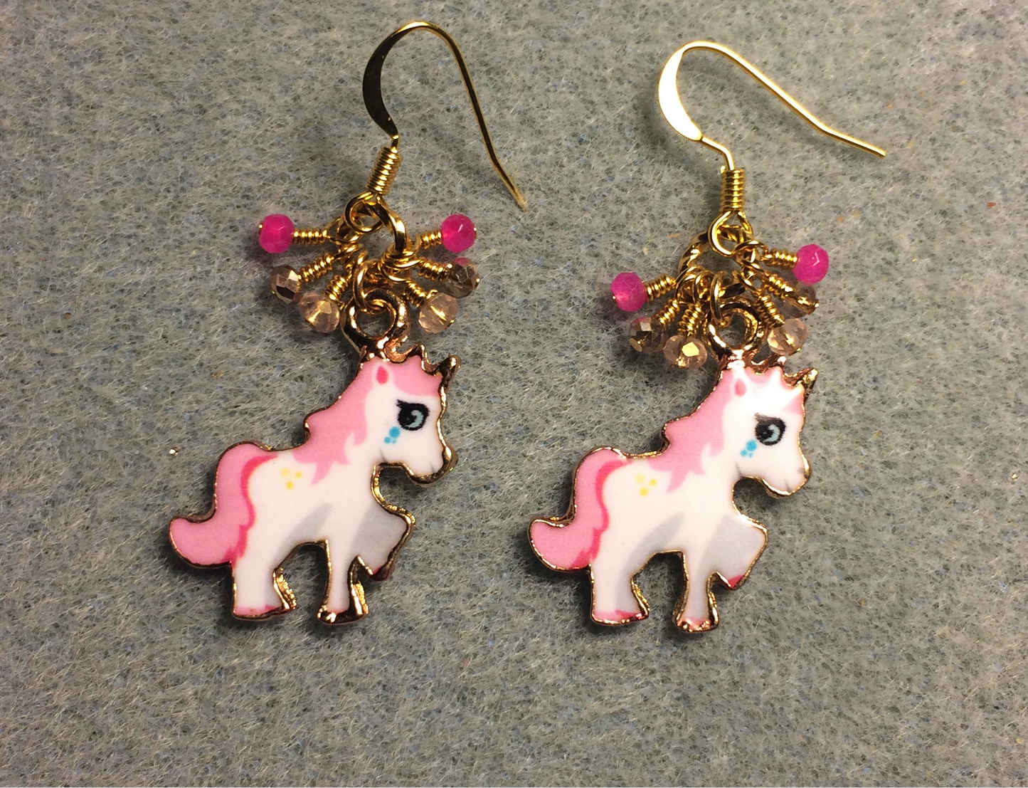 Small hot pink, white, and gold enamel unicorn charm earrings adorned with tiny dangling hot pink, light pink, and gold Chinese crystal beads.